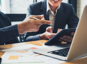 Planning Business Operations, people pointing at computer